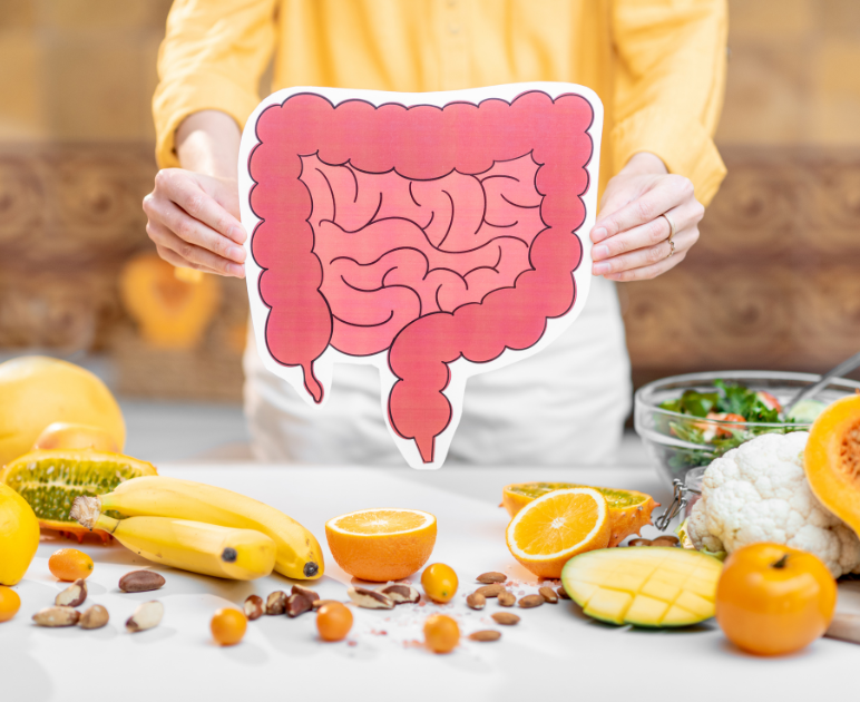 graphic of the digestive system, fruit and veg for healthy gut