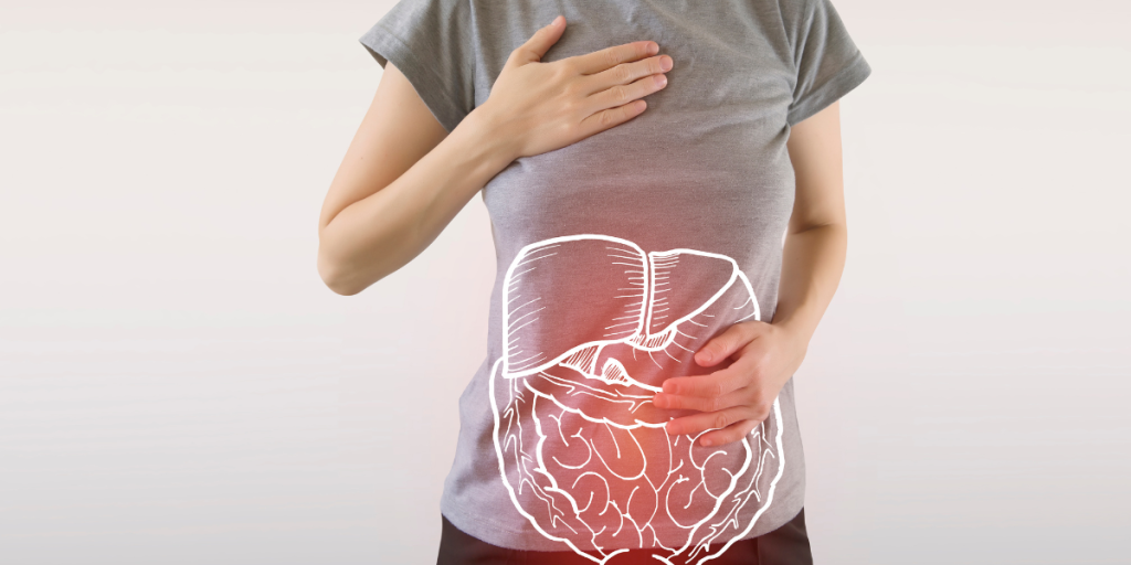 woman in t-shirt-holding her stomach